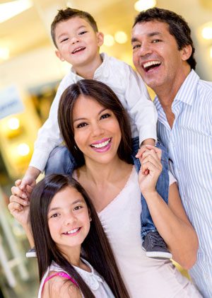 A family smiling after cosmetic dentistry appointments in Pasadena.